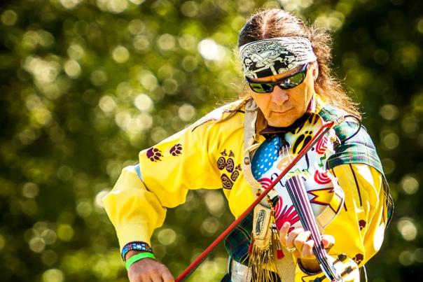 Nationally recognized artist Arvel Bird (Piute) plays his Celtic fiddle on stage during a free concert at the Oka Kapassa Festival