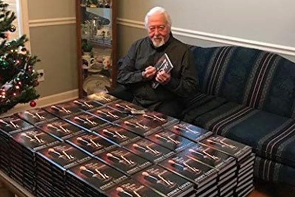 Benson native, Jimmy Capps, signing his books.