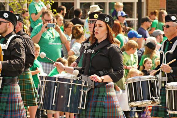 Woman plays a drum during the Lawrence St. Patrick's day parade