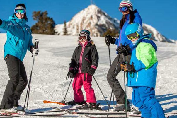 Family on a ski slope at Snowbasin Ski Resort