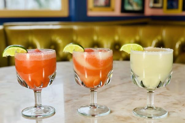 Three frozen margaritas on a table