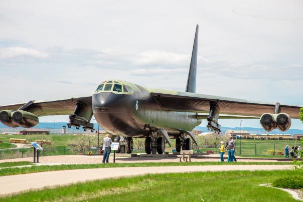 visitors walking around an airplane at the South Dakota Air & Space Museum outside of Rapid City,sd