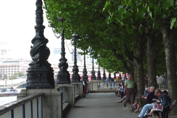 View of people enjoying the River Thames along the South Bank.