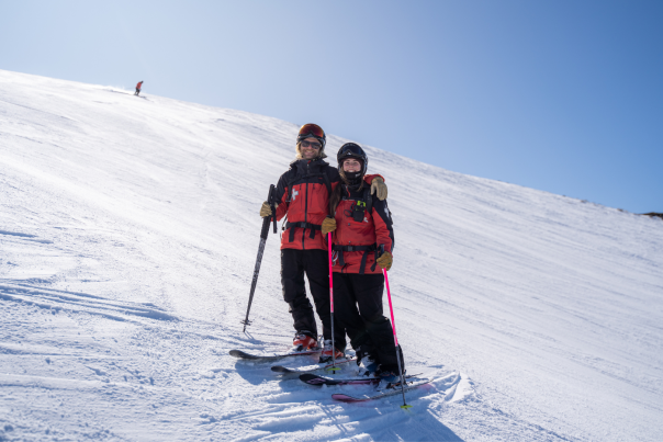 Ski patrollers Charlotte and Sam on the slopes at Coronet Peak