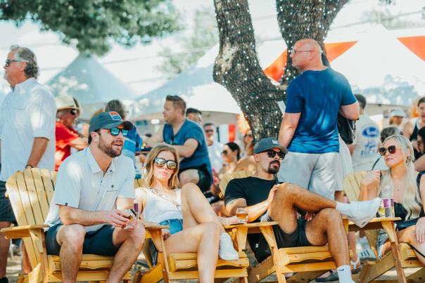 Group of people relaxing and enjoying Main Street Fest in Grapevine, Texas