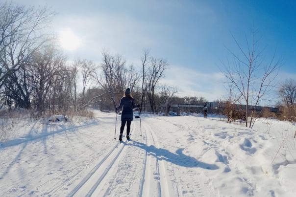 two people cross country skiing in winter