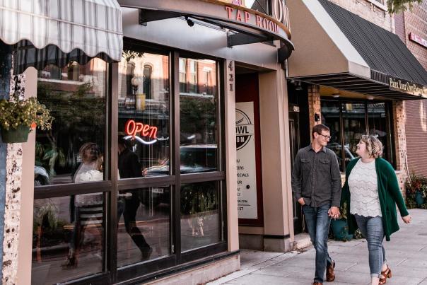 Couple walking in Downtown Oshkosh