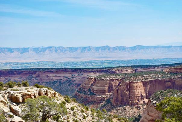 View of Colorado National Monument with Book Cliffs in the Background