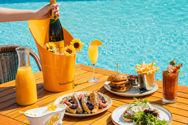 Poolside Brunch at Lola's by the Water in Pompano Beach, complete with a bottle of champagne.