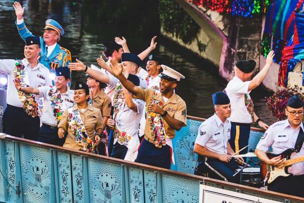Service men and woman waving on river barge