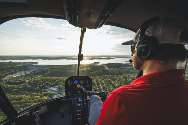 Helicopter tour pilot flying over Table Rock Lake in Branson, MO