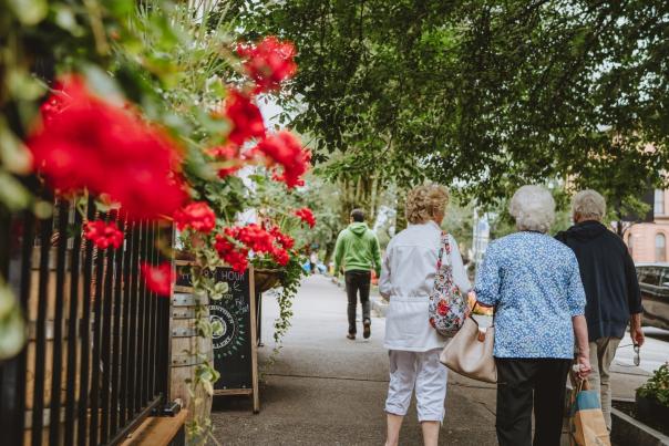 red flowers and women walking