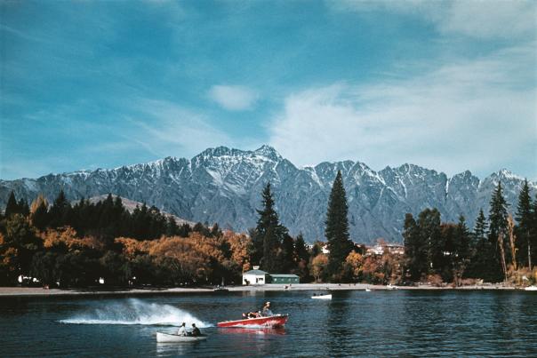 Historical photo of Kawarau Jet on Queenstown Lake with mountains in the background