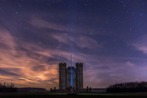 Castle silhoutted against twilight sky in Sussex