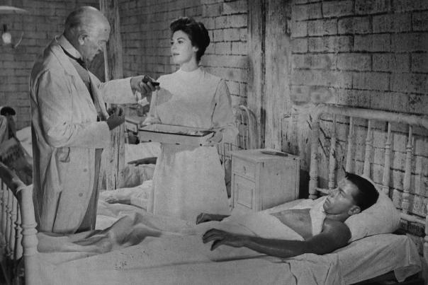 Ava Gardner in a scene from 55 Days at Peking in a hospital.