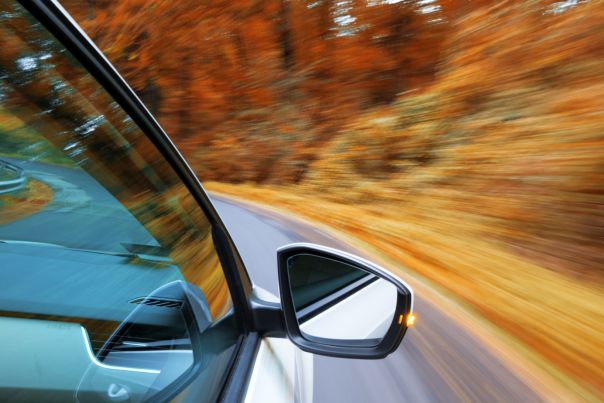 Late Fall Adventures Blog Cover - Car Driving on Fall Road with Yellow and Orange Foliage