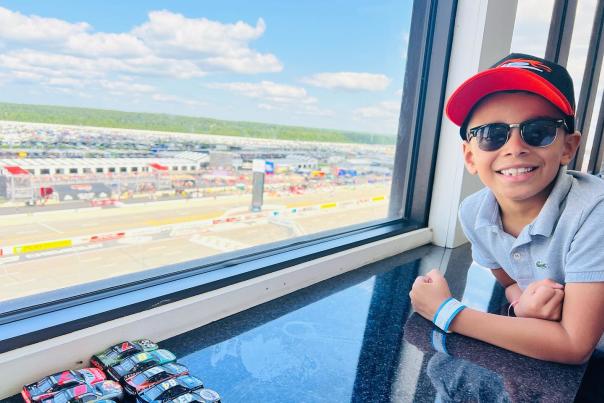 A young fan gets ready to watch the NASCAR action at Pocono Raceway