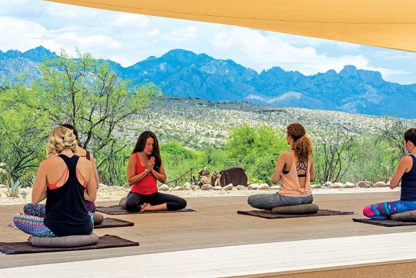 Women Meditating on Patio