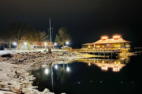 Lake Champlain boathouse on a snowy winter evening