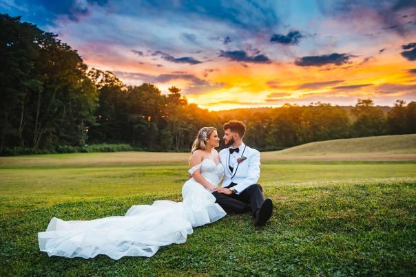 A bride and groom enjoy a beautiful sunset in the Pocono Mountains