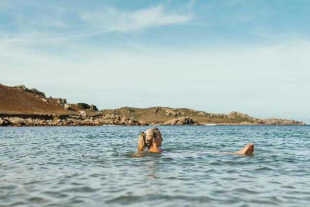 Woman swimming in Autumn