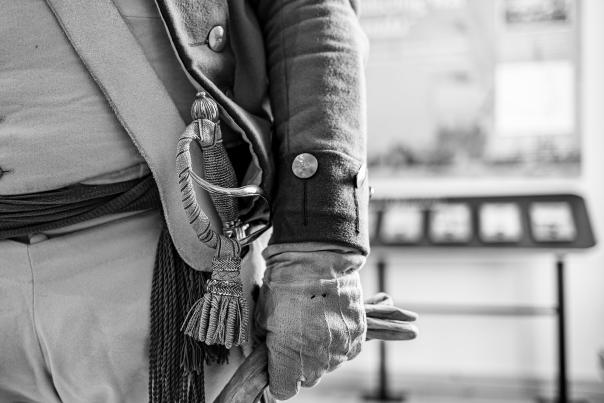 black and white photo of belt and hand of soldier