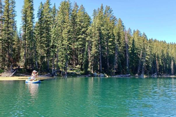 Woman Fly Fishing on a Paddleboard on The Grand Mesa