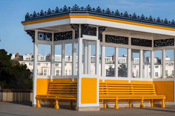 Photograph of one of the iconic yellow shelters at Southsea Seafront, restored following Southsea Coastal Scheme works