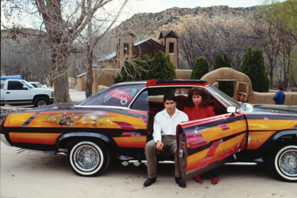 Dave Jaramillo Jr. and his wife, Irene, with his late father’s lowrider, “Dave’s Dream,” in front of the Santuario de Chimayó, 1992, New Mexico Magazine