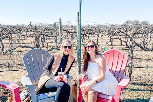 Ladies drinking wine outdoors