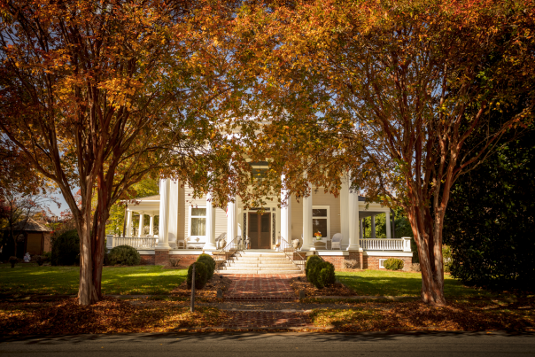 Fall trees in front of historic home