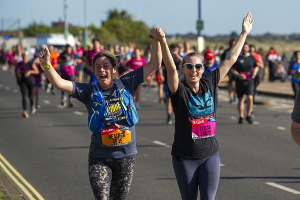 Participants taking on the Great South Run, heading along the seafront section near the end of the race. Credit: Harry Elliott Photography
