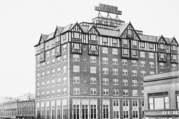 A historic black and white photo of the hotel alex johnson in downtown rapid city, sd