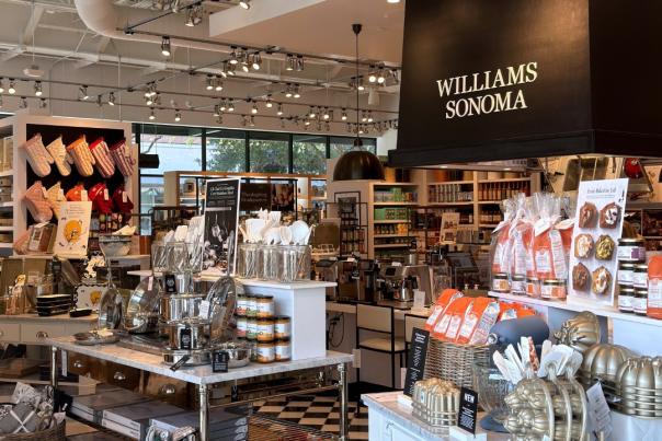 The interior of Williams Sonoma at Hughes Landing is packed with cookware and boutique food items for sale, including stainless steel pans, oven mitts, baking tins, fall bread starters, etc.
