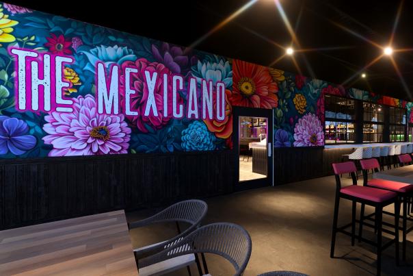 interior view of restaurant with floral mural The Mexicano
