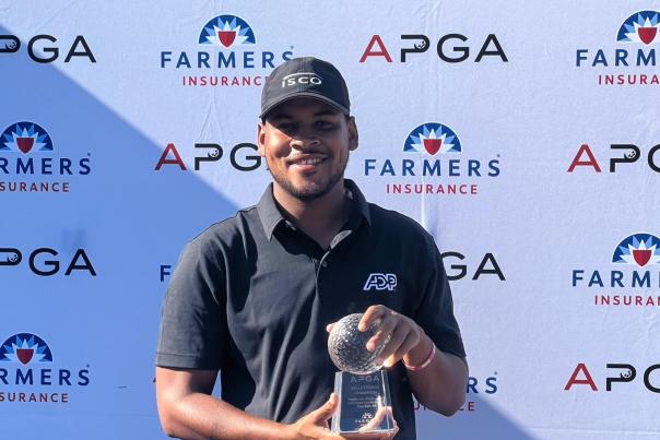 Marcus Byrd displays his APGA Tour Valley Forge trophy after winning the second annual championship Wednesday at Bluestone Country Club in Blue Bell, Montgomery County, PA.