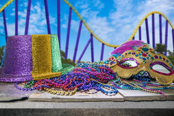 Mardi Gras accessories positioned in front of roller coaster