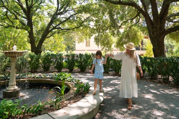 Mother and daughter walking through Historic Columbia Garden