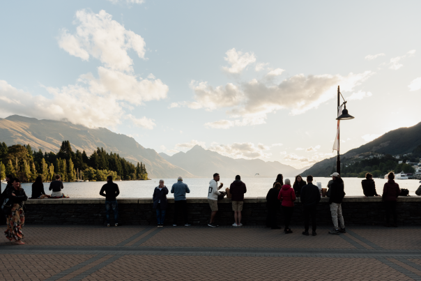 Queenstown Bay at dusk with mountains in the background