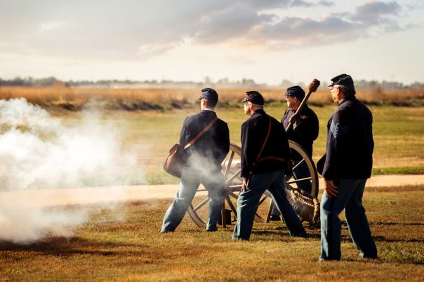 civil war reenactors fire a canon