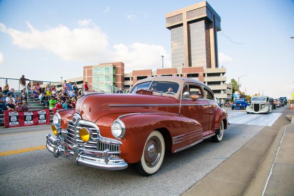 Car going down route 66 at route 66 festival in Springfield, Missouri