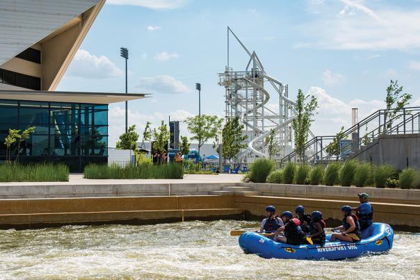 A raft from Riversport Adventure Park navigates the waters of the Boathouse District in OKC
