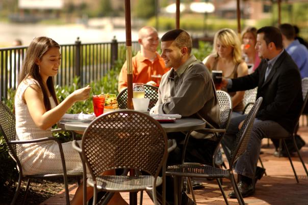 Friends enjoy a meal and fresh air while dining out in Wilmington.