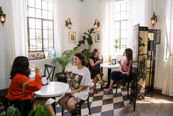 Women drinking wine in a cafe