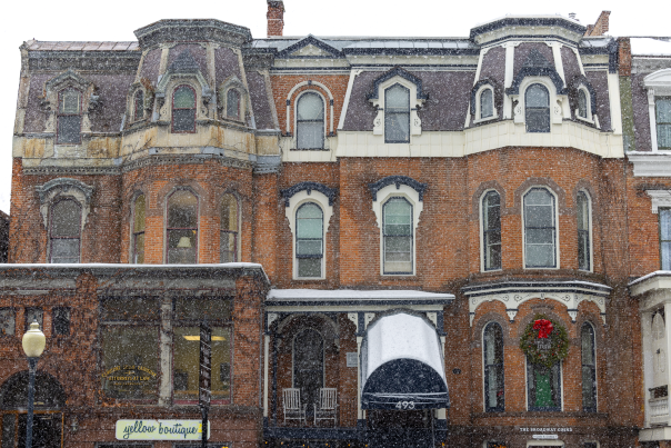 brown building downtown saratoga springs in snowy scene