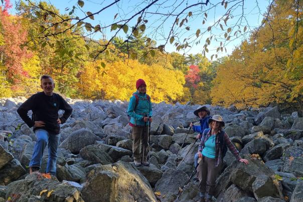 Hikers from the Philadelphia Trail Club gather for a hike in the fall foliage.