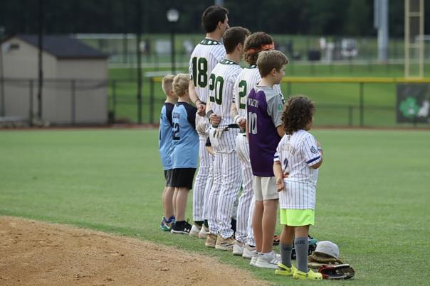 Clayton Clovers Team Line Up with Kids Before Game
