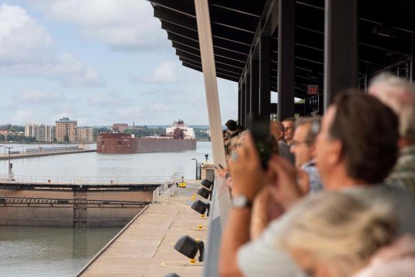Viewers watching a large barge enter the Soo Locks in the Upper Peninsula Michigan, USA