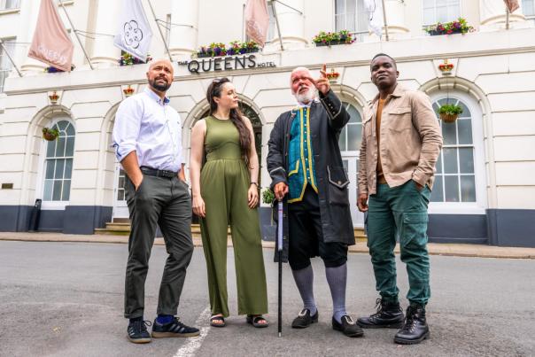 Group tour Cheltenham. Group stood outside the Queens Hotel Cheltenham with tour guide Phil from Cheltenham Promenaders.