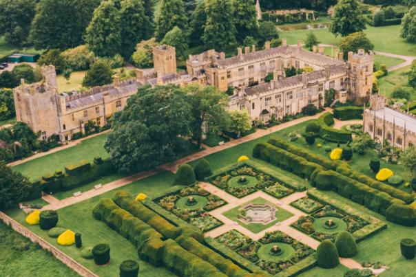 A photo by Rob Tarren of Sudeley Castle from the air with the gardens in the foreground